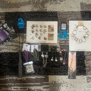 Lot of jewelry and sample make up and accessories